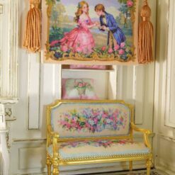 A romantic proposal scene with a couple in vintage attire, surrounded by roses and framed with gold, a miniature Aubusson tapestry.