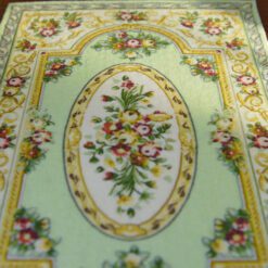 Green Victorian floral rug with gold and pink accents