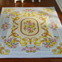Soft blue Aubusson floral rug with roses and golden detailing