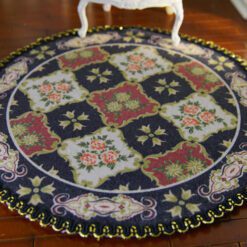 Modern French Aubusson miniature rug with intricate floral motifs in soft blues and golds