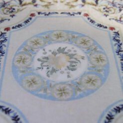 Modern Aubusson-style miniature rug with floral motifs in blue, pink, and cream