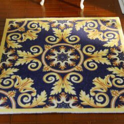 Miniature Aubusson square rug with scroll design in navy and gold.