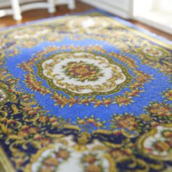 Modern Chinese-inspired miniature rug with floral motifs in blue, red, and gold