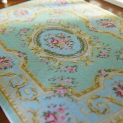Light blue Victorian floral rug with roses and golden accents