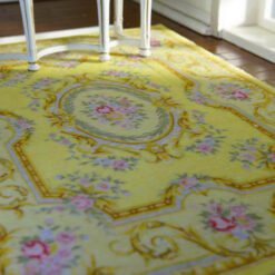 Light yellow Victorian rug with floral details and golden accents