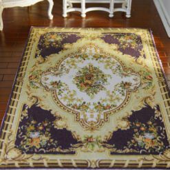 Classic Aubusson rug with purple and floral design, featuring a central medallion.
