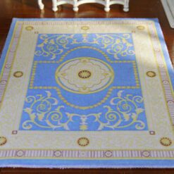 Simple French Aubusson miniature rug with soft floral motifs and scrollwork in cream and green