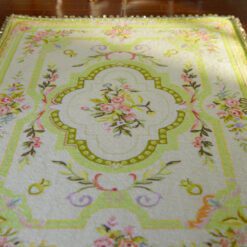 Pastel French Aubusson rug with floral patterns and soft colors