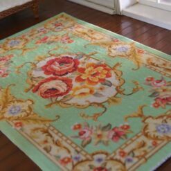 Louis XV Aubusson miniature rug in green with floral scroll design