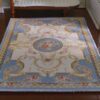 Victorian miniature rug in light blue with floral medallion