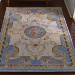 Victorian miniature rug in light blue with floral medallion