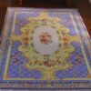 Victorian Rococo miniature rug with blue and yellow background and floral accents