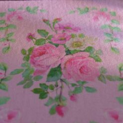 Light blue miniature rug with yellow roses and pink floral details