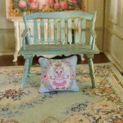 Miniature pillow with fairy piglet surrounded by roses and lavender