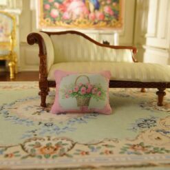 Miniature pillow featuring a basket of pink roses tied with a pink ribbon