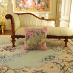 Miniature pillow with a wreath of pink, yellow, and lavender roses