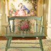 Miniature pillow featuring pink roses and white flowers in green foliage