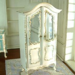 White dollhouse wardrobe with mirrored doors and gold embellishments