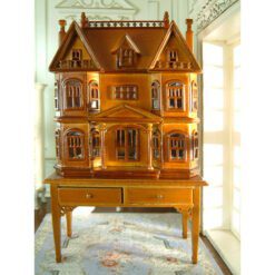 Victorian-style dollhouse cabinet in walnut finish with two-drawer table