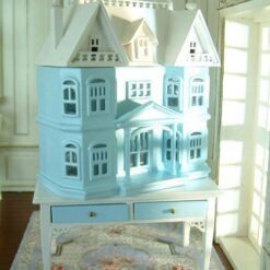 Pastel Blue Victorian Dollhouse Cabinet 11 Victorian-style dollhouse cabinet in pastel blue on a white table