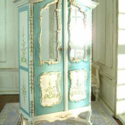 White dollhouse kitchen cabinet with marble-style countertop