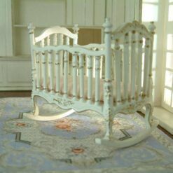 Victorian-style miniature rocking crib in white