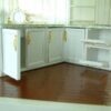 White dollhouse kitchen cabinet with marble-style countertop