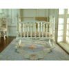 Victorian-style miniature rocking crib in white