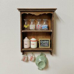 Miniature vintage wall cabinet with decorative floral paper
