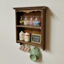 Miniature vintage wall cabinet with decorative floral paper