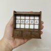 Miniature kitchen cabinet with tiled backing for dollhouses