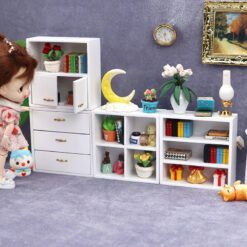 Set of four miniature wooden cabinets in various finishes for dollhouse storage