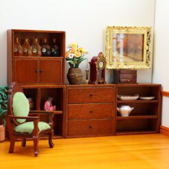Set of four miniature wooden cabinets in various finishes for dollhouse storage