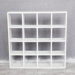16-grid miniature shelving unit available in black and white finishes.