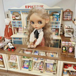 Double-sided dollhouse bar counter display cabinet with vintage drawers.