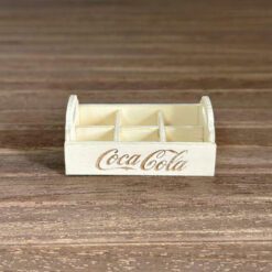 Miniature Coca-Cola bottle crate kit with six compartments.
