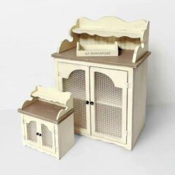 A French-inspired vintage dollhouse sideboard with glass doors.