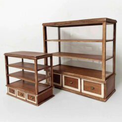 A vintage dollhouse bakery display cabinet with shelves and glass panels.