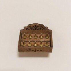 A miniature staircase spool storage box with decorative details.
