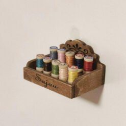 A miniature staircase spool storage box with decorative details.