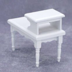 Scandinavian-style white miniature console table with a raised shelf.