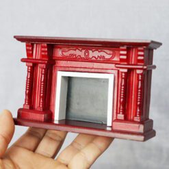 Miniature red baroque fireplace for dollhouse with intricate pillar design