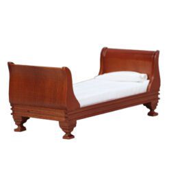 Miniature wooden bed with striped bedding for dollhouse