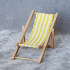 Set of four miniature beach chairs with striped fabric in red, blue, green, and yellow for dollhouses.