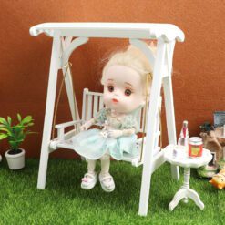 Large miniature swing with white wooden frame and golden chains
