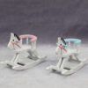 Miniature wooden rocking horse with blue detailing for dollhouse nurseries.