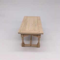 Miniature wooden dining table for dollhouses.