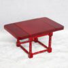 Miniature wooden dining table with intricate design for dollhouses.