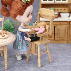 Miniature wooden baby high chair for dollhouses.