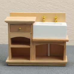 Miniature wooden bathroom sink cabinet with white sink and gold faucets for dollhouses.